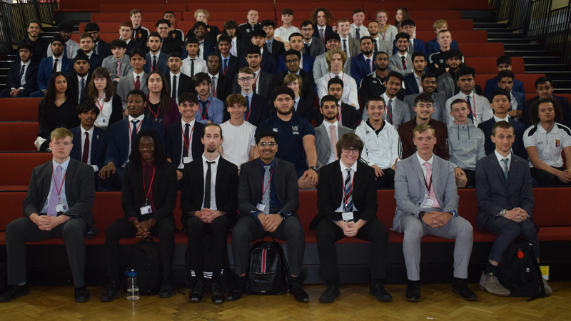 Year 13 Leavers pose for a photo on the tiered seating.